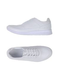Низкие кеды и кроссовки Lacoste