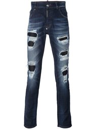 джинсы с рваными деталями Philipp Plein