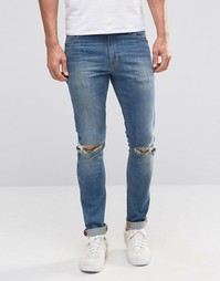 Синие супероблегающие джинсы с рваными коленками ASOS - Синий