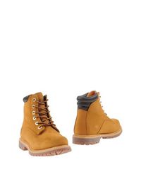 Полусапоги и высокие ботинки Timberland