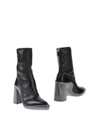 Полусапоги и высокие ботинки Prada