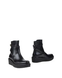 Полусапоги и высокие ботинки CÉline