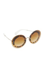 Круглые солнцезащитные очки в прозрачной оправе Miu Miu