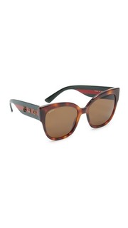 Крупные солнцезащитные очки тигровой расцветки Gucci