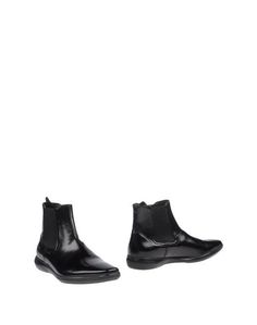 Полусапоги и высокие ботинки Prada
