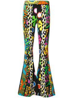 psychedelic printed flared trousers Moschino
