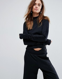 Черный топ с длинными рукавами и высоким воротом Puma - Черный