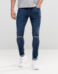 Темные супероблегающие джинсы с рваными коленями ASOS - Синий