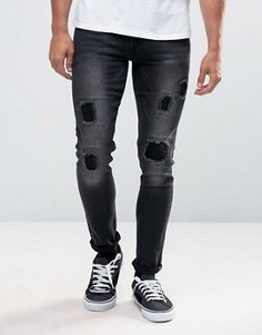 Черные супероблегающие джинсы с потертостями ASOS - Черный