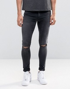 Черные выбеленные супероблегающие джинсы с рваными коленями ASOS - Черный