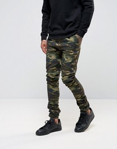Джоггеры скинни с камуфляжным принтом ASOS - Зеленый