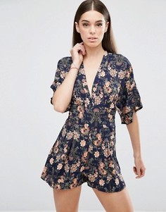 Ромпер с V-образным вырезом и цветочным принтом AX Paris - Темно-синий