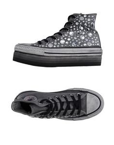 Низкие кеды и кроссовки Converse Limited Edition