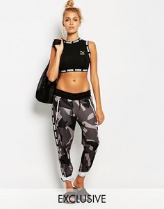 Спортивные брюки с серым камуфляжным принтом Puma - Мульти