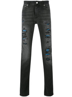 джинсы с потертой отделкой Alexander McQueen