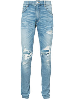 джинсы с потертой отделкой Amiri