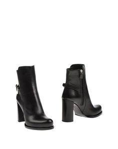 Полусапоги и высокие ботинки Prada