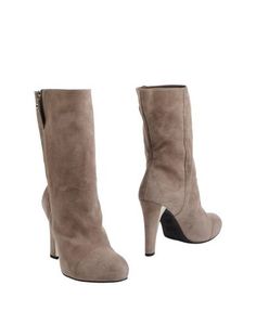 Полусапоги и высокие ботинки Stuart Weitzman