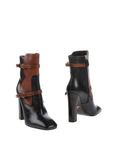 Полусапоги и высокие ботинки Prada