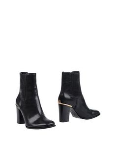 Полусапоги и высокие ботинки Tory Burch