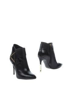 Полусапоги и высокие ботинки Guess