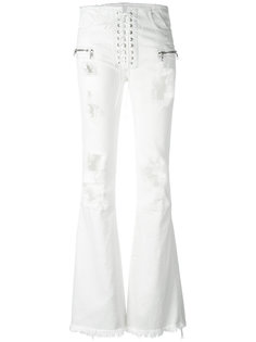 расклешенные джинсы с рваными деталями Unravel Project