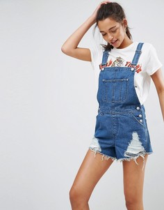Голубые джинсовые шорты-комбинезон с необработанным краем ASOS - Синий