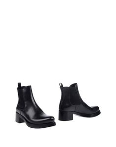 Полусапоги и высокие ботинки Prada