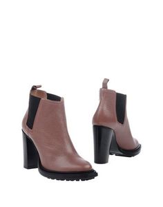 Полусапоги и высокие ботинки Pollini