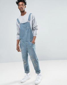 Светлый джинсовый комбинезон в винтажном стиле с прорехами ASOS - Синий