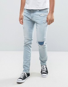 Выбеленные рваные укороченные джинсы скинни с заплатами Hollister - Синий