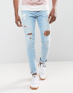 Светло-синие джинсы скинни с рваной отделкой ASOS - Синий
