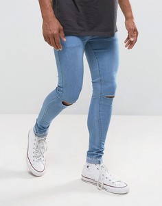 Супероблегающие джинсы с рваными коленями и необработанным краем Criminal Damage - Синий