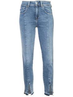 faded jeans with ankle slits 7 For All Mankind