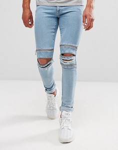 Светлые супероблегающие джинсы с молниями ASOS - Синий