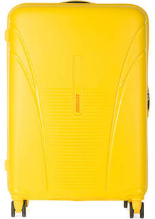 Желтый чемодан на колесах American Tourister