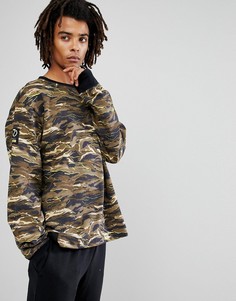 Свитшот свободного кроя с камуфляжным принтом Puma x XO 57534751 - Зеленый