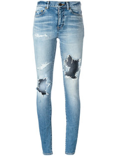 узкие джинсы с прорезями Saint Laurent