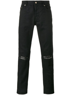джинсы с заклепками на коленях Saint Laurent