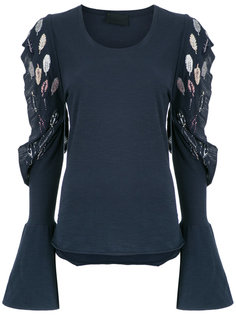 cut out details top Andrea Bogosian