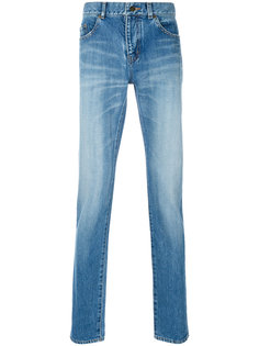 джинсы с протертыми деталями Saint Laurent