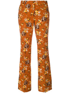 расклешенные брюки с цветочным узором Coach