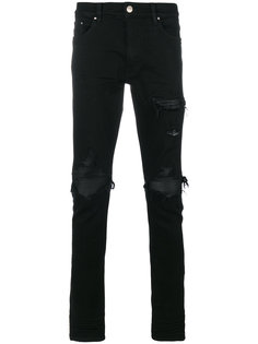 джинсы скинни с эффектом потертости Amiri