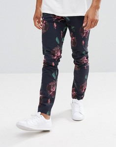 Брюки зауженного кроя с крупным принтом роз ASOS - Темно-синий