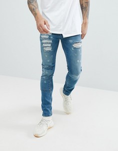 Дымчато-синие супроблегающие джинсы с заплатками ASOS - Синий