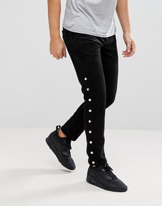 Черные зауженные брюки с кнопками по бокам ASOS - Черный