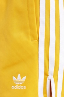 Желтые шорты с полосками Adidas