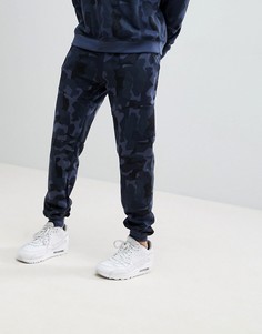 Синие спортивные брюки с камуфляжным принтом boohooMAN - Темно-синий