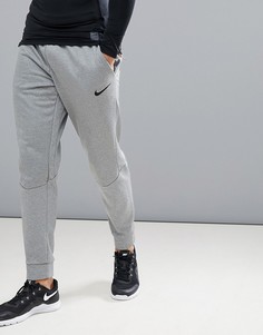 Суженные книзу серые джоггеры Nike Training Therma 800193-091 - Серый