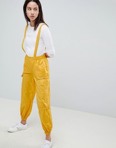 Брюки со сборками ASOS DESIGN - Желтый
